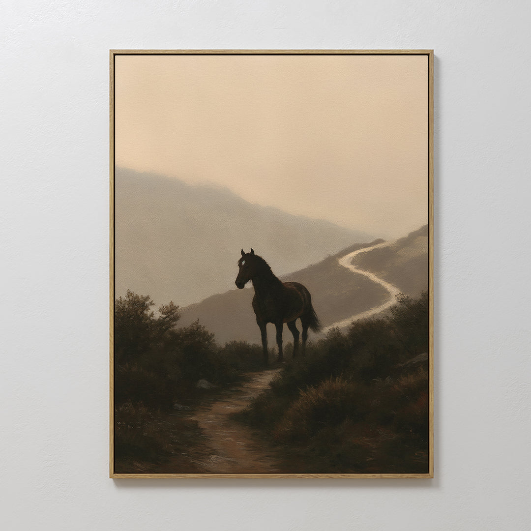 Winding Trail Canvas Art features a lone black horse on a dirt path through misty mountains in soft, muted tones—an atmospheric nature piece ideal for enhancing your space.