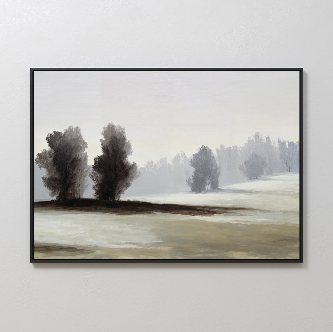 The Winter Dusk Canvas Art features a framed misty landscape with tall, bare trees on snowy hills under a pale sky—ideal as neutral wall decor for any room.