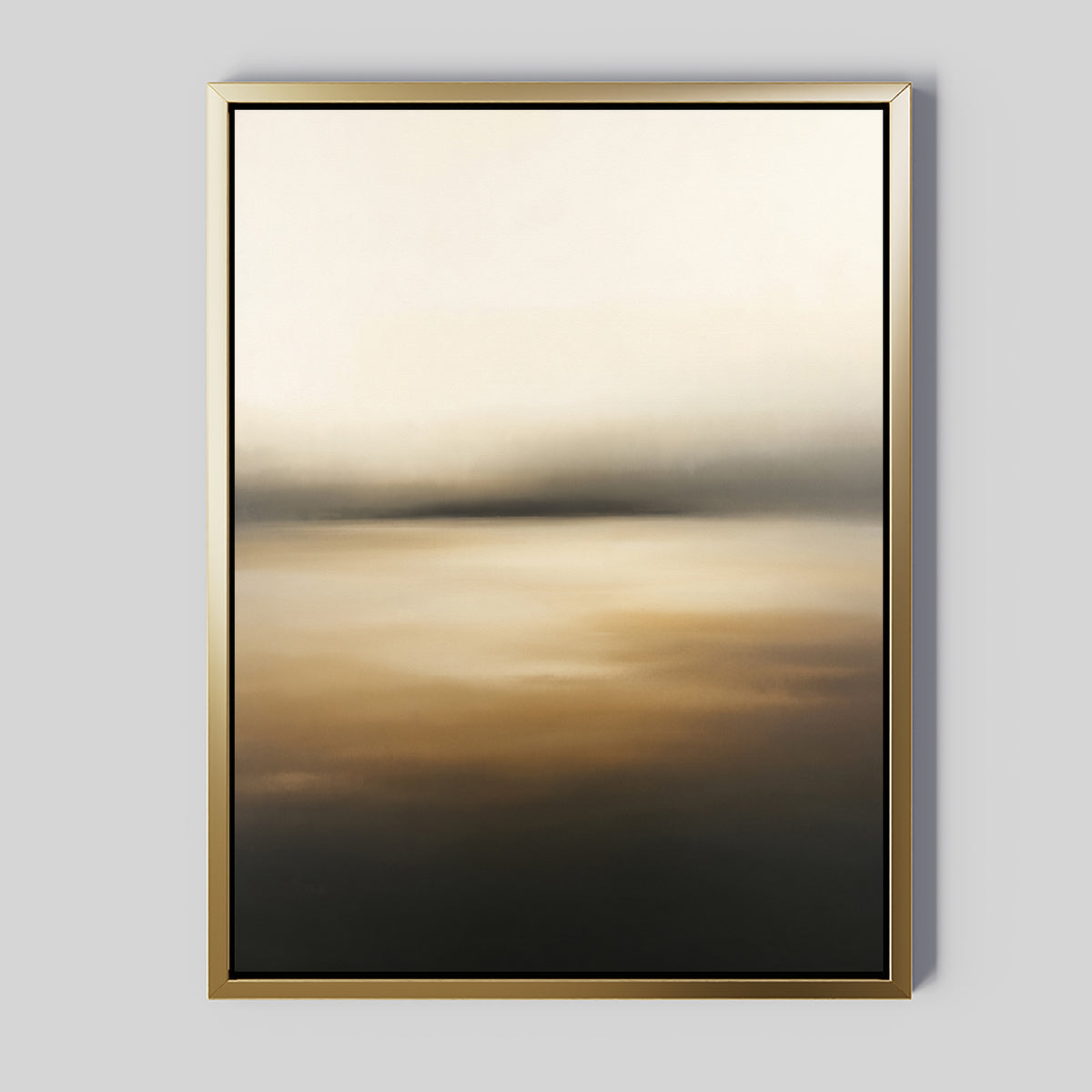 The Amber Fields Canvas Art - Vertical showcases an abstract landscape with soft beige, brown, black, and amber gradients. A metallic gold frame contrasts elegantly against the plain light gray background for a tranquil effect.