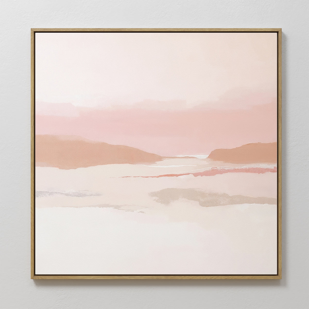 The Blush Mesa Canvas Art - Square features minimalist wall art with abstract hills in pastel pink, peach, and cream. Soft earth tones and a hazy sky are framed by a thin border, perfect for brightening any light-colored wall.