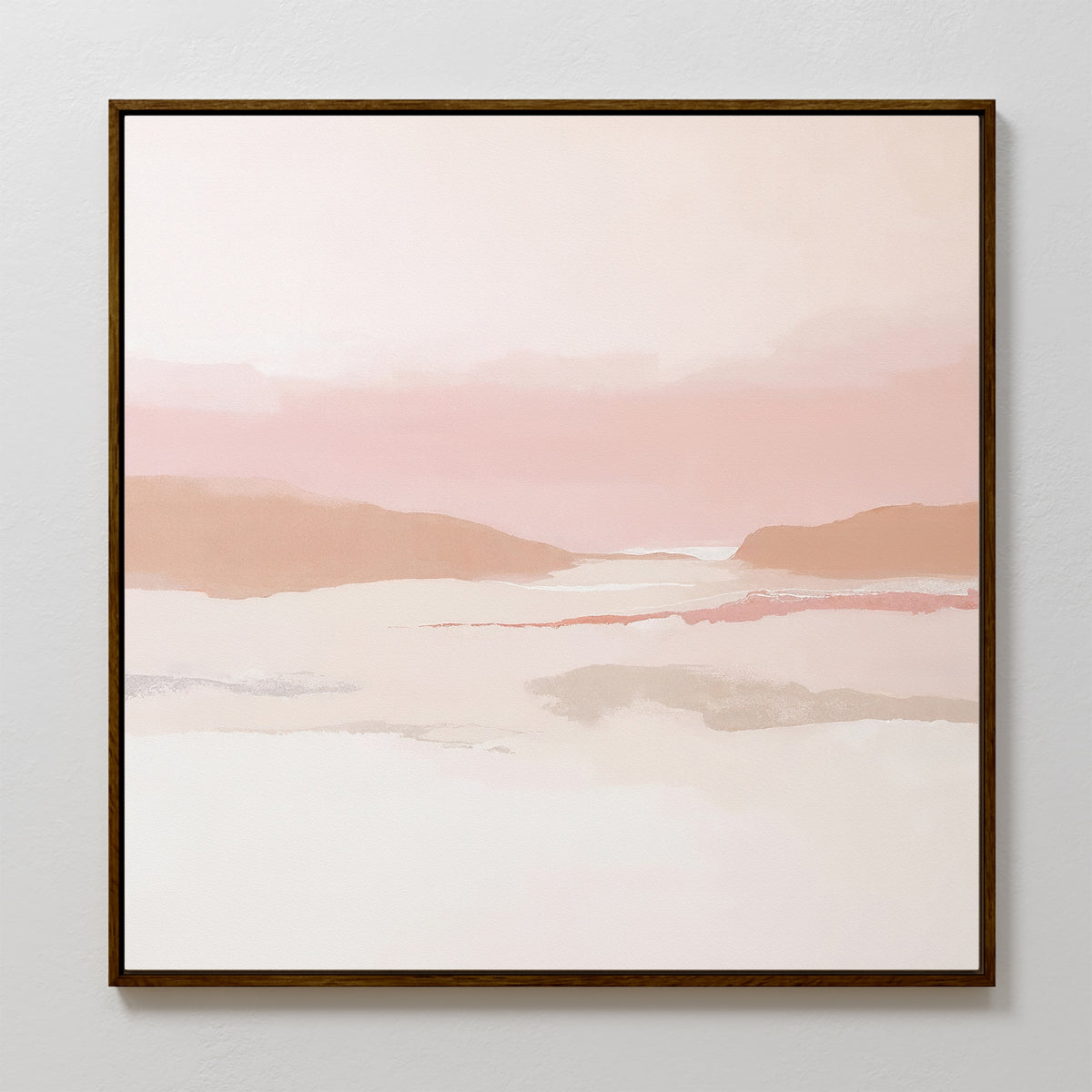 The Blush Mesa Canvas Art - Square features an abstract landscape in soft pink, beige, and white tones with distant hills and a calm sky, set in a sleek dark wooden frame—ideal for bringing tranquility to any space.