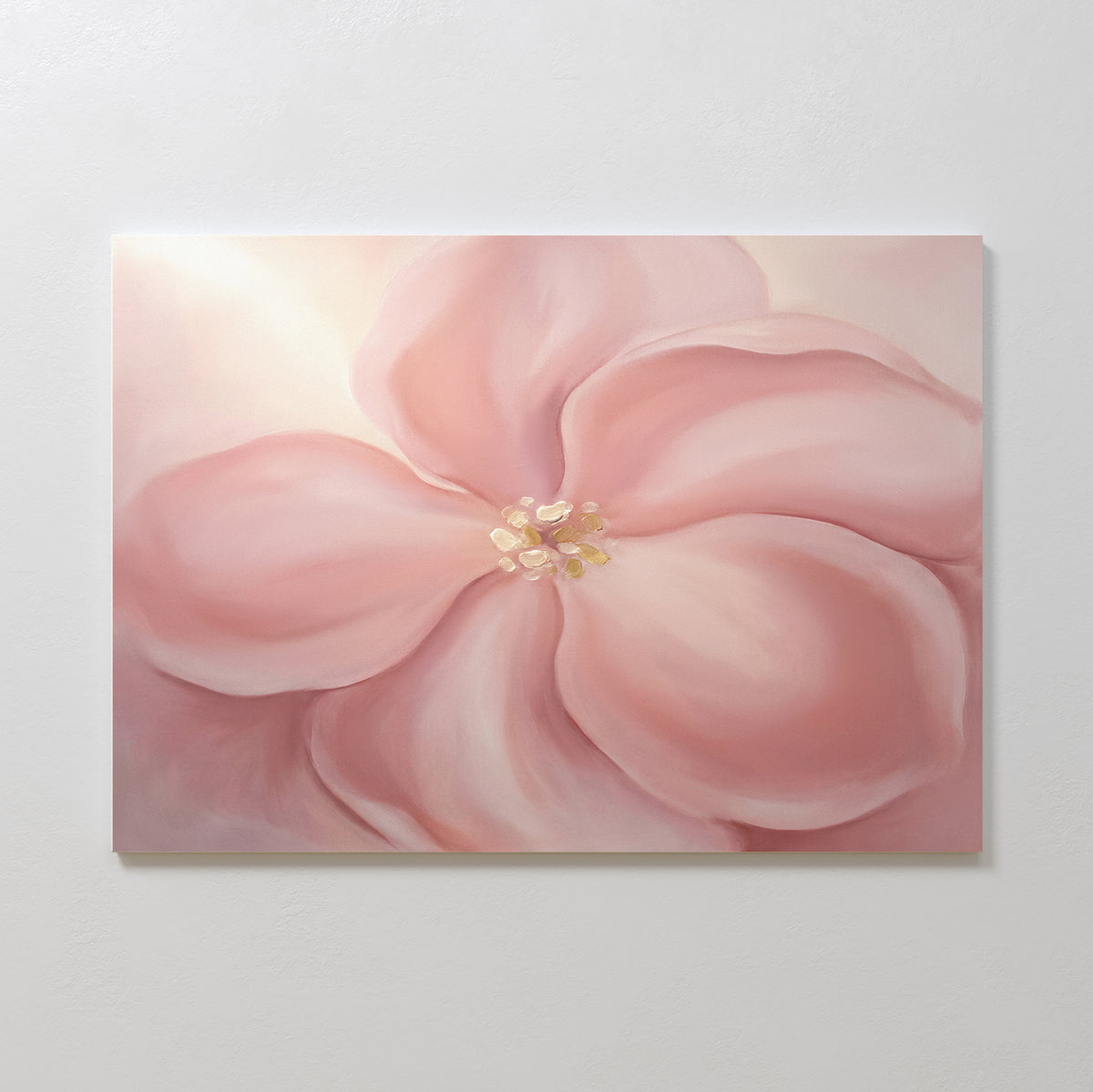 The Blushing Magnolia Canvas Art - Horizontal features a large, soft pink flower with delicate petals and a light yellow center on a pale background, creating a gentle, dreamy, and pastel look.