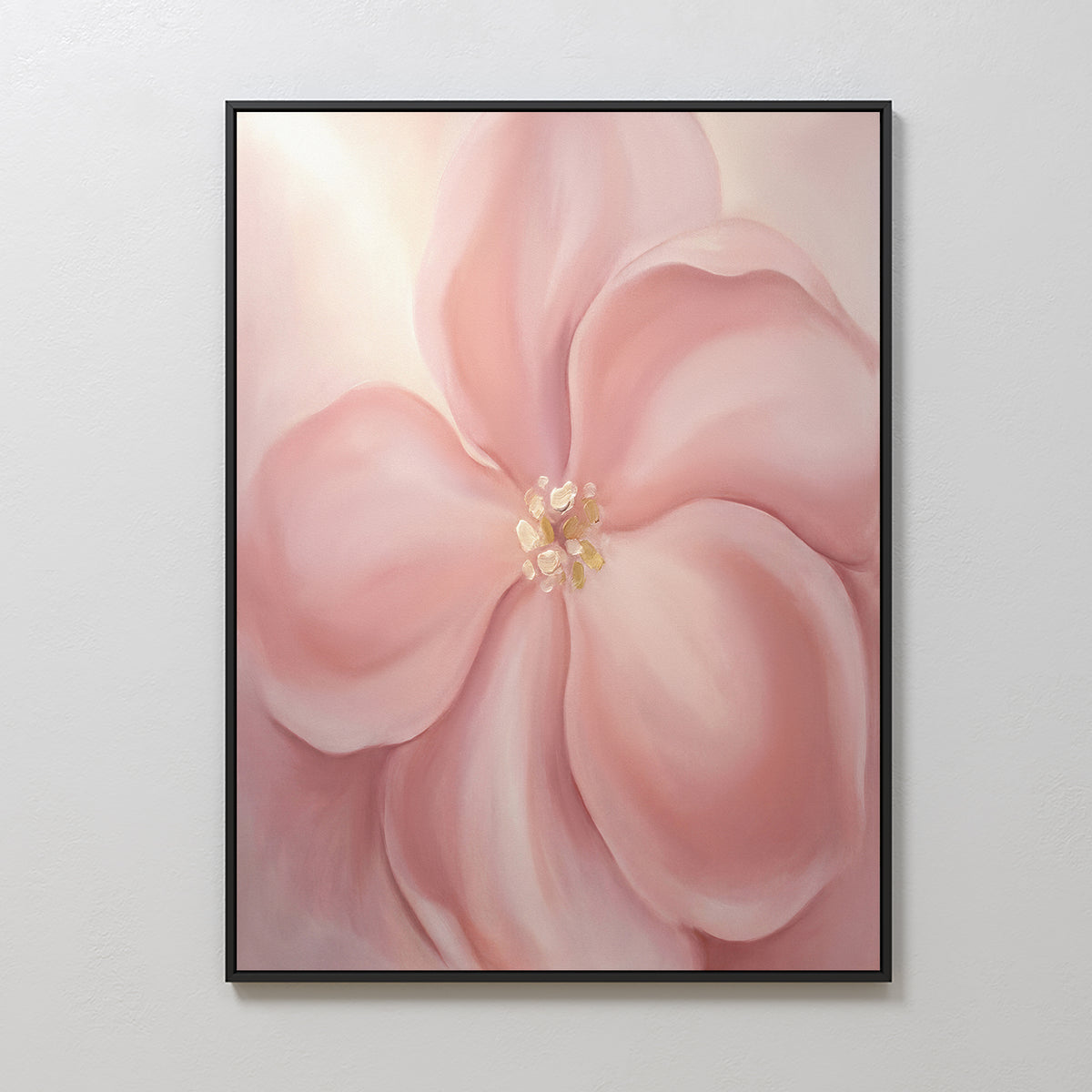 The Blushing Magnolia Canvas Art - Vertical showcases a delicate blush pink magnolia with large, overlapping petals and a soft yellow center on a pale backdrop—perfect as romantic, abstract wall art for any room.