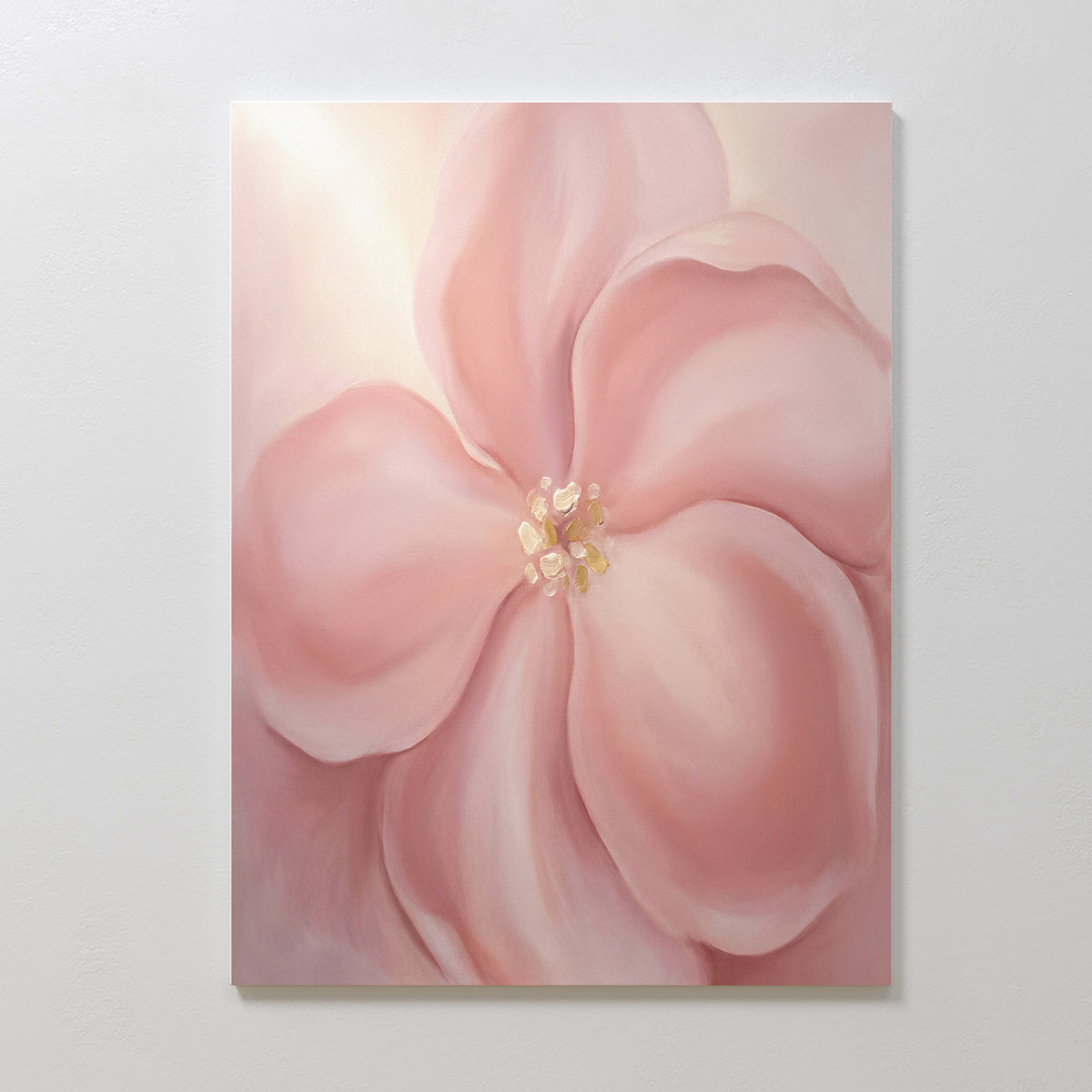 Blushing Magnolia Canvas Art - Vertical features a smooth, slightly abstract large soft pink flower with rounded petals and a pale yellow center—perfect as romantic wall art on a white wall.