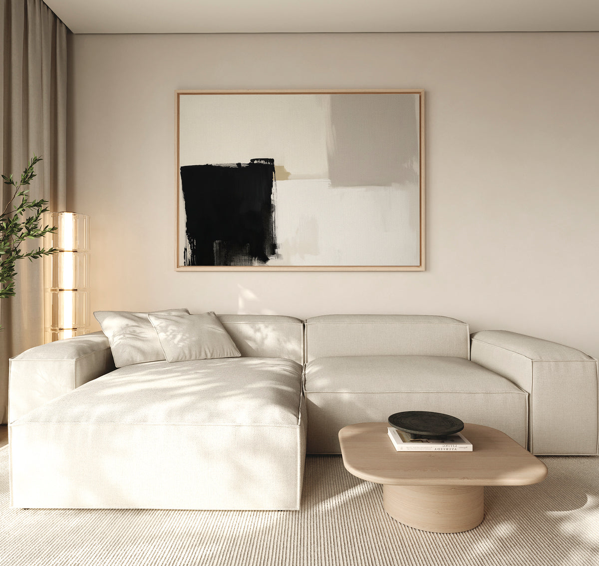 A modern living room showcases a large beige sectional, a light wood coffee table with a black bowl, a tall plant, and the Bold Division Canvas Art - Horizontal—a perfect touch of inspiration for minimalist spaces.