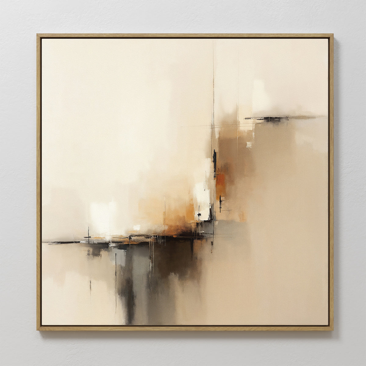 The Burnt Sienna Convergence Canvas Art - Square features a contemporary mix of beige, cream, brown, and black brushstrokes. Framed in thin gold, this elegant wall art adds a soft, modern touch to any light-colored room.