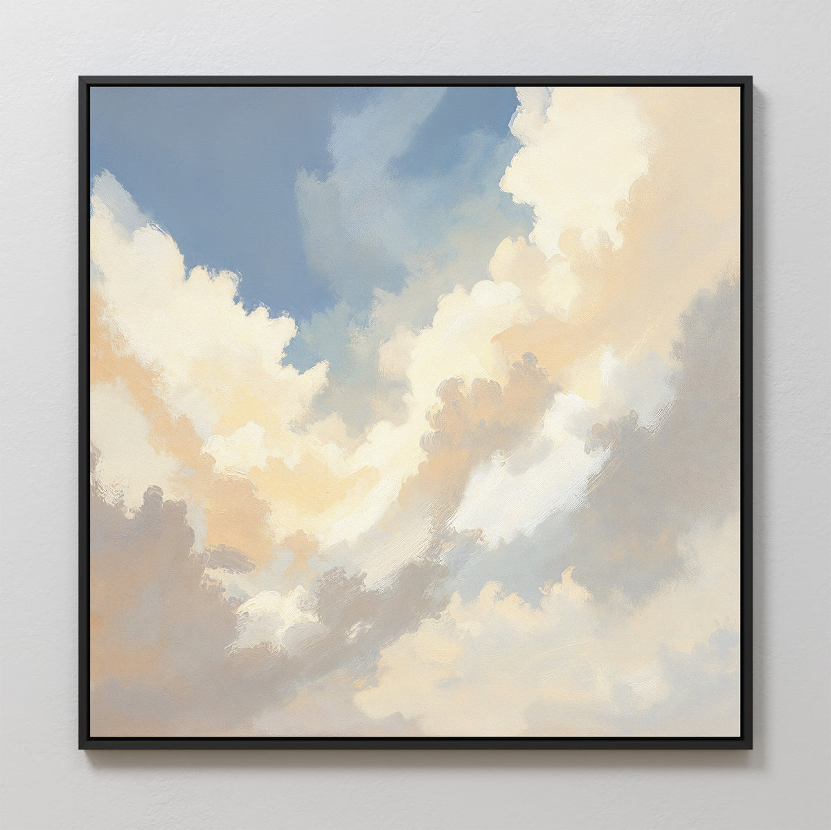 The Celestial Embrace Canvas Art - Square features a framed print of a cloudy sky in soft whites, creams, and grays on a blue background, adding serene style to your home decor when hung on a light-colored wall.