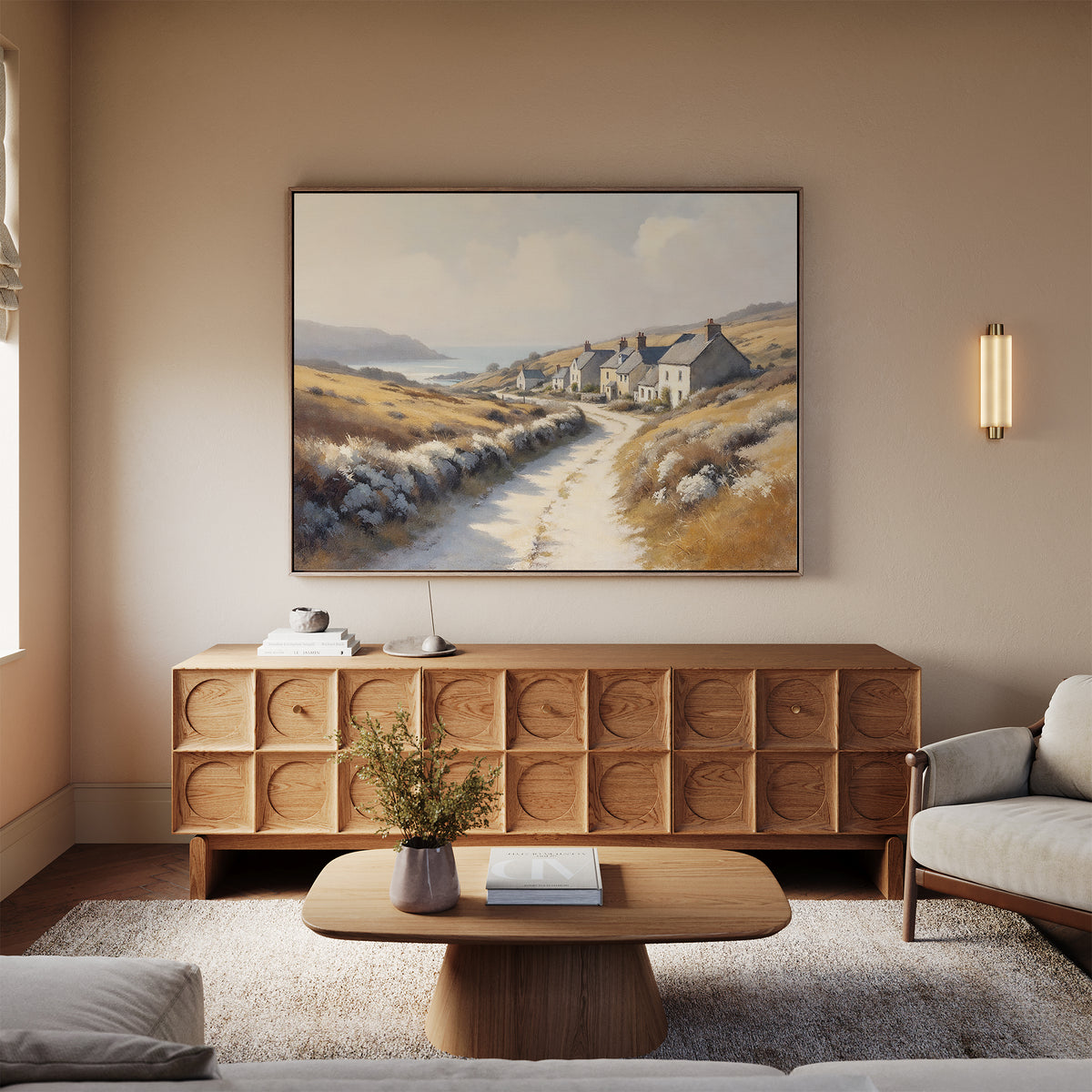 A cozy living room featuring a modern wooden coffee table, sideboard, beige sofa, wall-mounted lamp, and the Coastal Haven Canvas Art - Horizontal above the sideboard. A vase with greenery on the coffee table adds to the relaxed vibe.