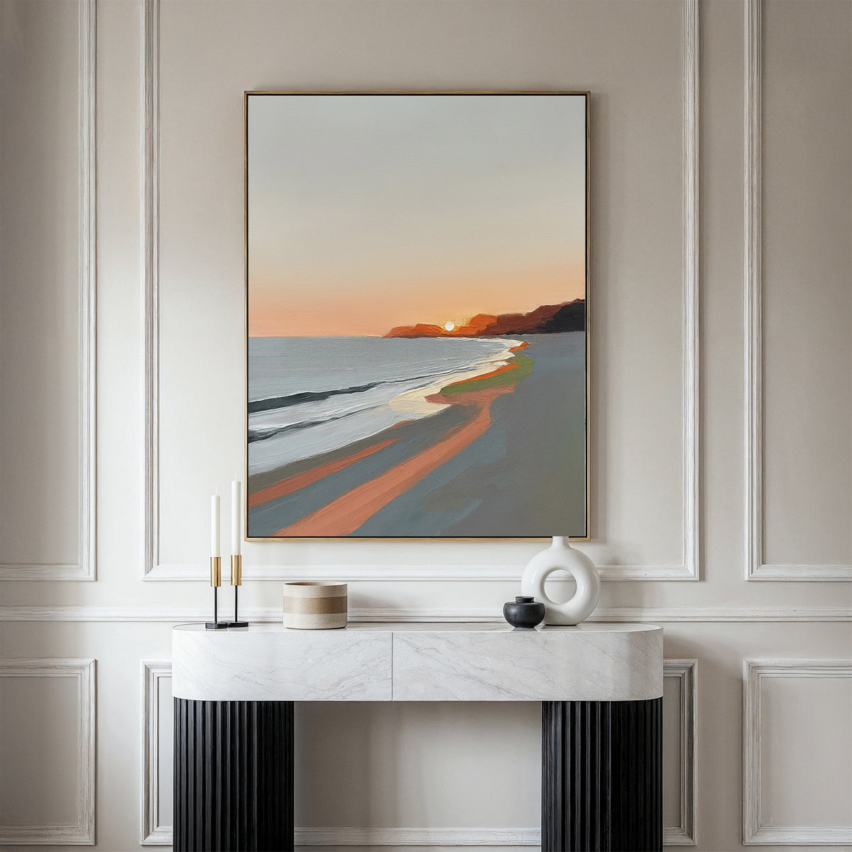 The Coastal Reverie Canvas Art - Vertical hangs on a light paneled wall above a modern console table with candles and minimalist vases, bringing serene coastal style to your home decor.