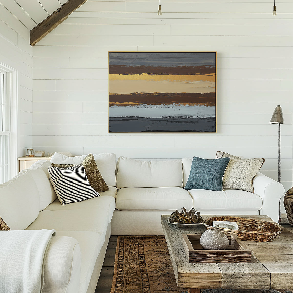 Bright, airy living room with white shiplap walls, a large sectional sofa, rustic wooden coffee table, and earthy sophistication from the Coastal Strata Canvas Art - Horizontal displayed above the couch.