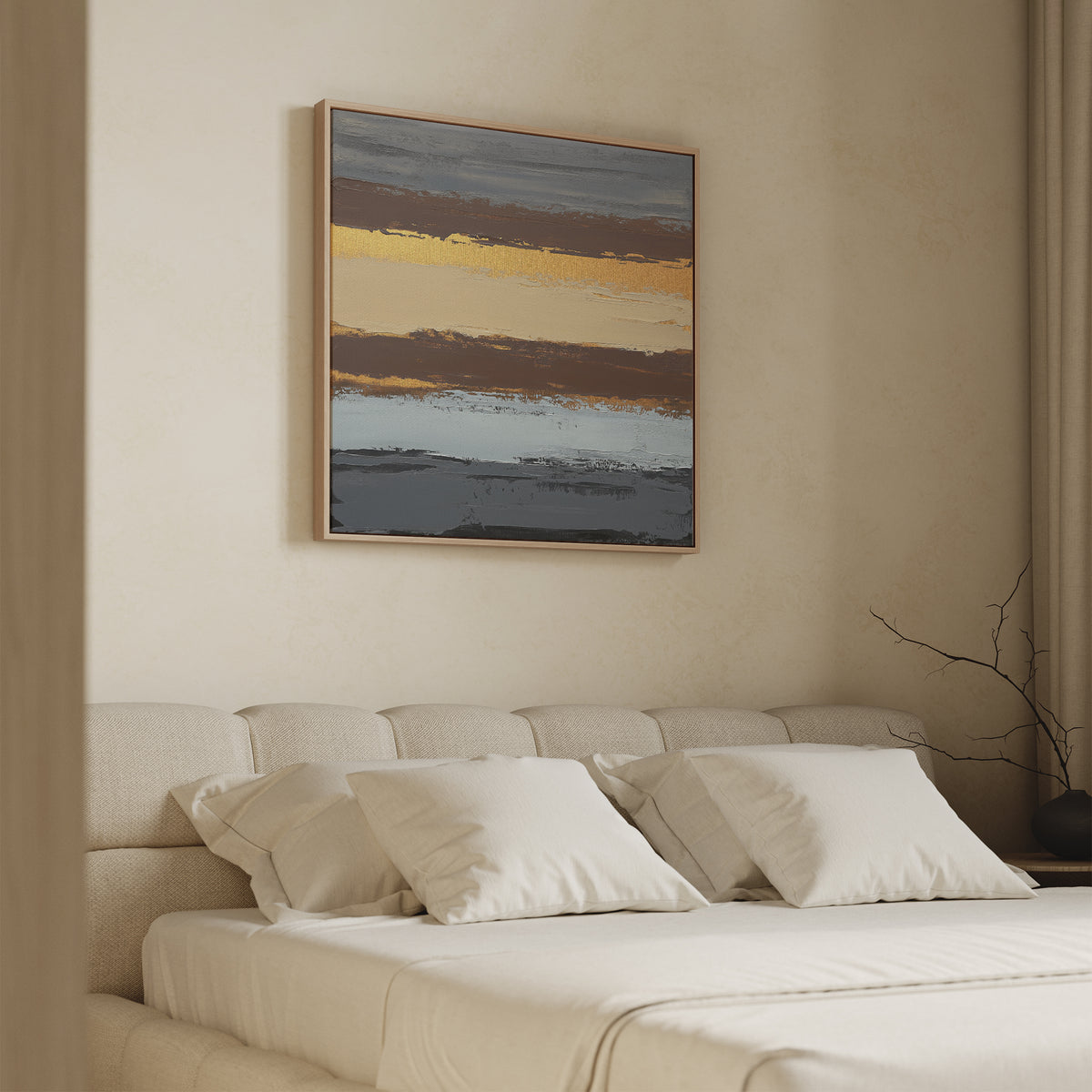 A modern bedroom features the Coastal Strata Canvas Art - Square above a beige bed with pillows, neutral walls, and a bare branch in a vase on the nightstand. The art brings earthy sophistication with gold, brown, and gray tones.