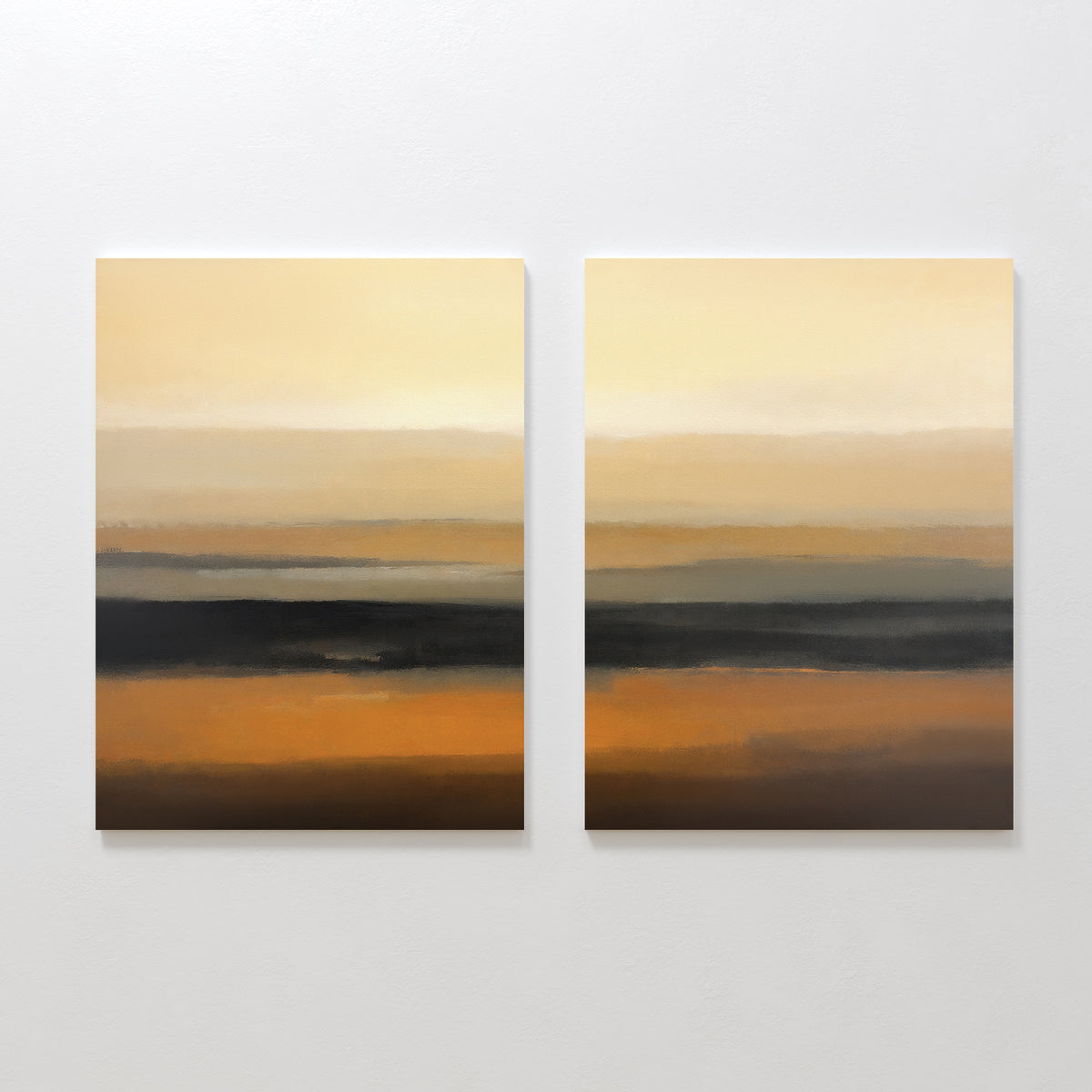 The Desert Mirage - Set Of 2 features abstract prints with horizontal bands in beige, orange, brown, and black earth tones, creating a serene desert landscape vibe against a white wall.
