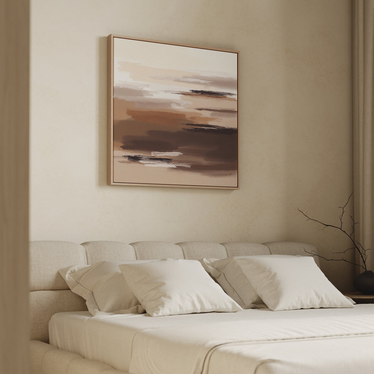 A minimalist bedroom features a beige upholstered bed with white bedding and the Desert Winds Canvas Art - Square, an abstract earth-toned print, above the headboard. A bare branch in a vase on the nightstand completes the serene Nordic Park look.