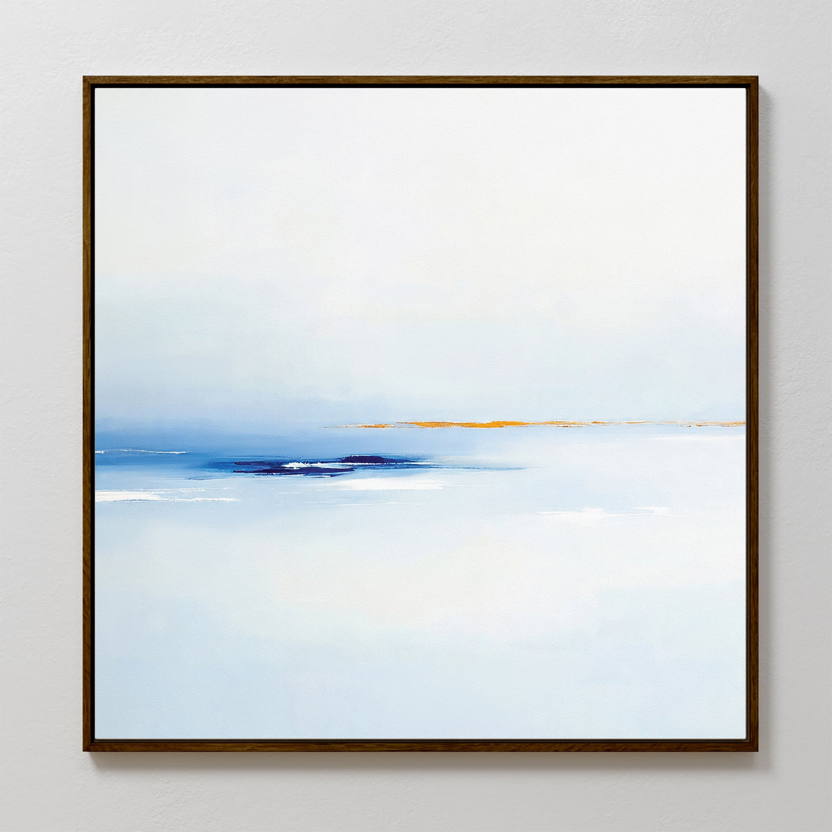 The Distant Archipelago Canvas Art - Square features soft blue and white tones with a touch of orange near the horizon, evoking a tranquil seascape. This contemporary piece has a slim dark frame and is shown on a light-colored wall.