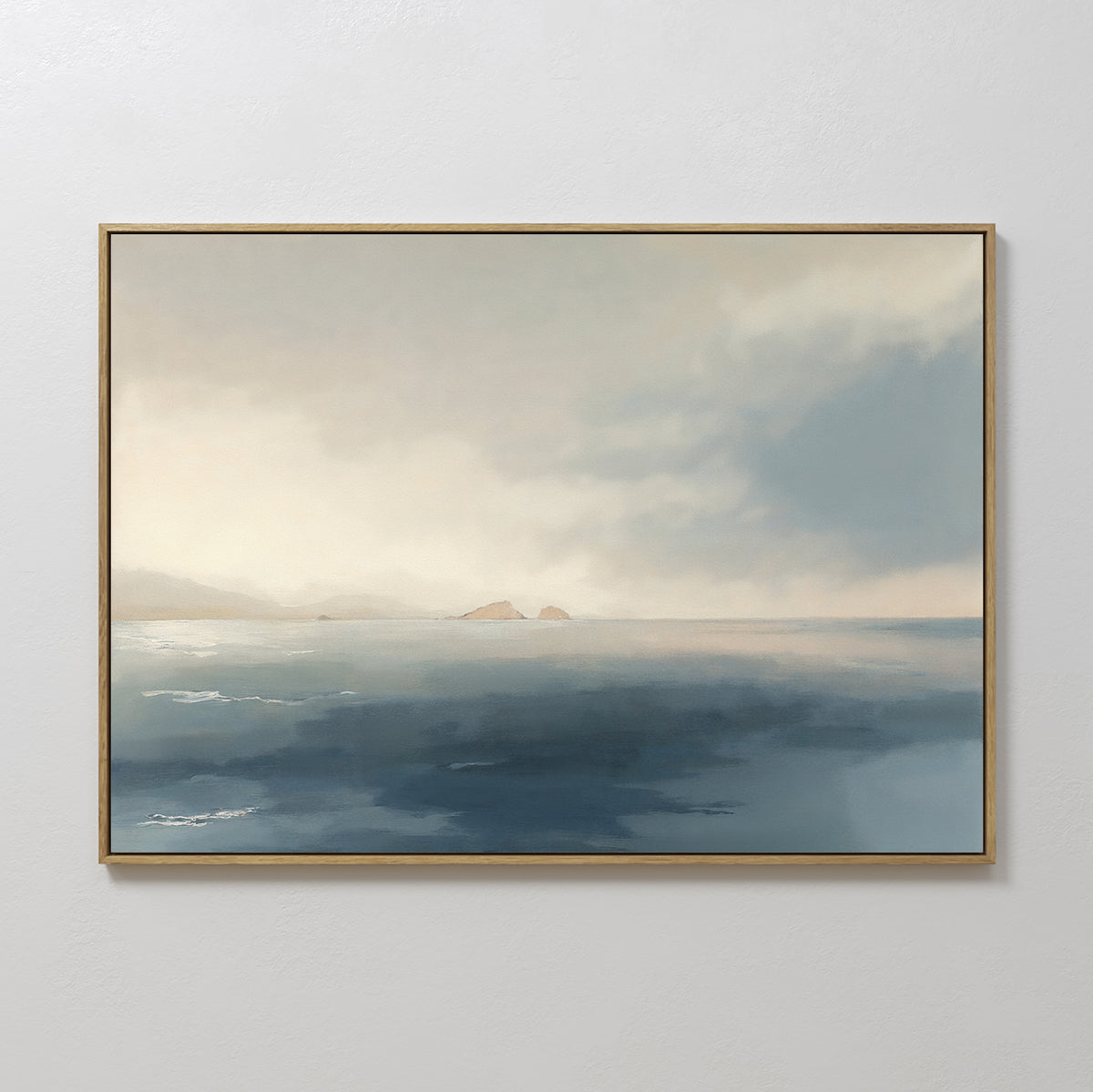 The Distant Isles Canvas Art - Horizontal features a calm seascape with misty skies and blue-toned waves, adding tranquil decor to any plain white wall.