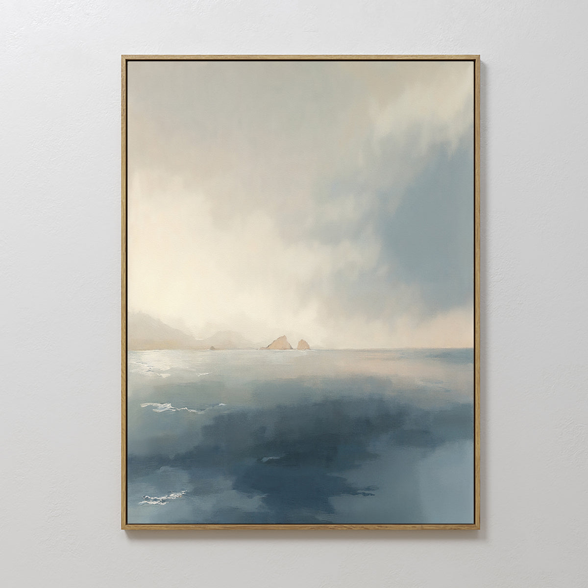 The Distant Isles Canvas Art - Vertical features a tranquil ocean with distant islands and a hazy sky in soft blues, grays, and whites—an ideal framed artwork to bring serene Nordic Park-inspired vibes to your space.