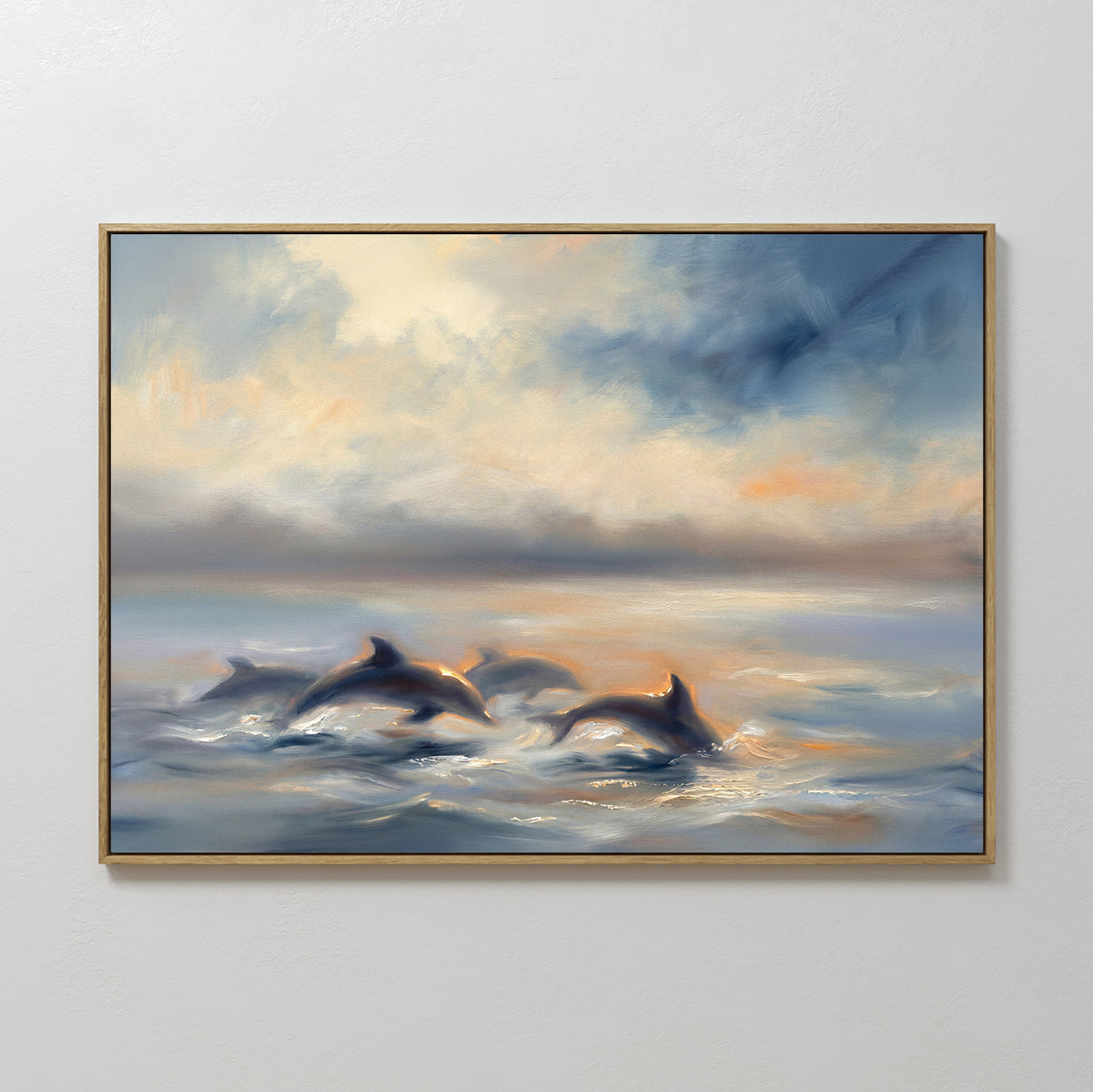 The Dolphin Pod at Sunset Canvas Art - Horizontal features dolphins swimming under a cloudy sky with golden sunlight in muted blues and grays, making this serene piece ideal for coastal-themed wall decor.
