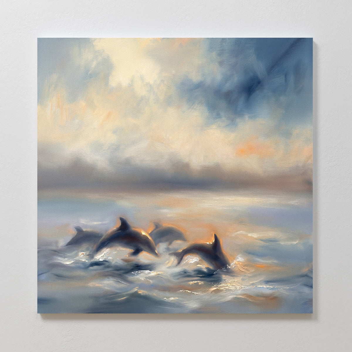 The Dolphin Pod at Sunset Canvas Art - Square features dolphins swimming in the ocean with soft, dreamy colors and a glowing sky. This wall art brings a tranquil, ethereal vibe to your space, adding a touch of serenity to any room.