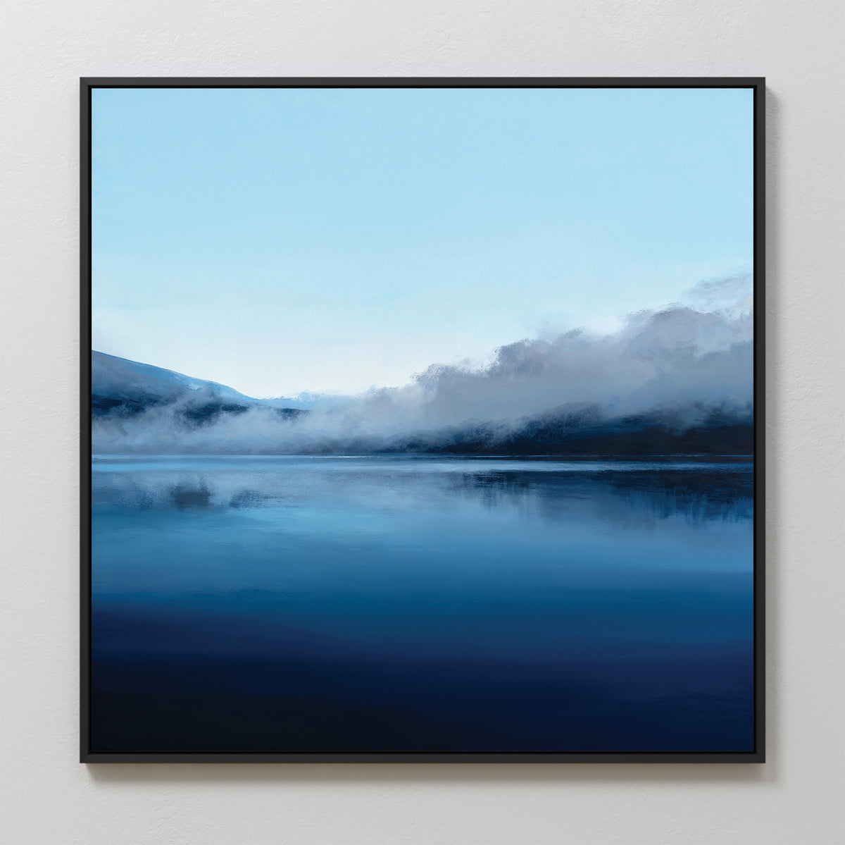 The Fjord Mist Canvas Art - Square features a peaceful lake with misty hills and a pale blue sky, perfect as Nordic wall art or tranquil decor for your bedroom.