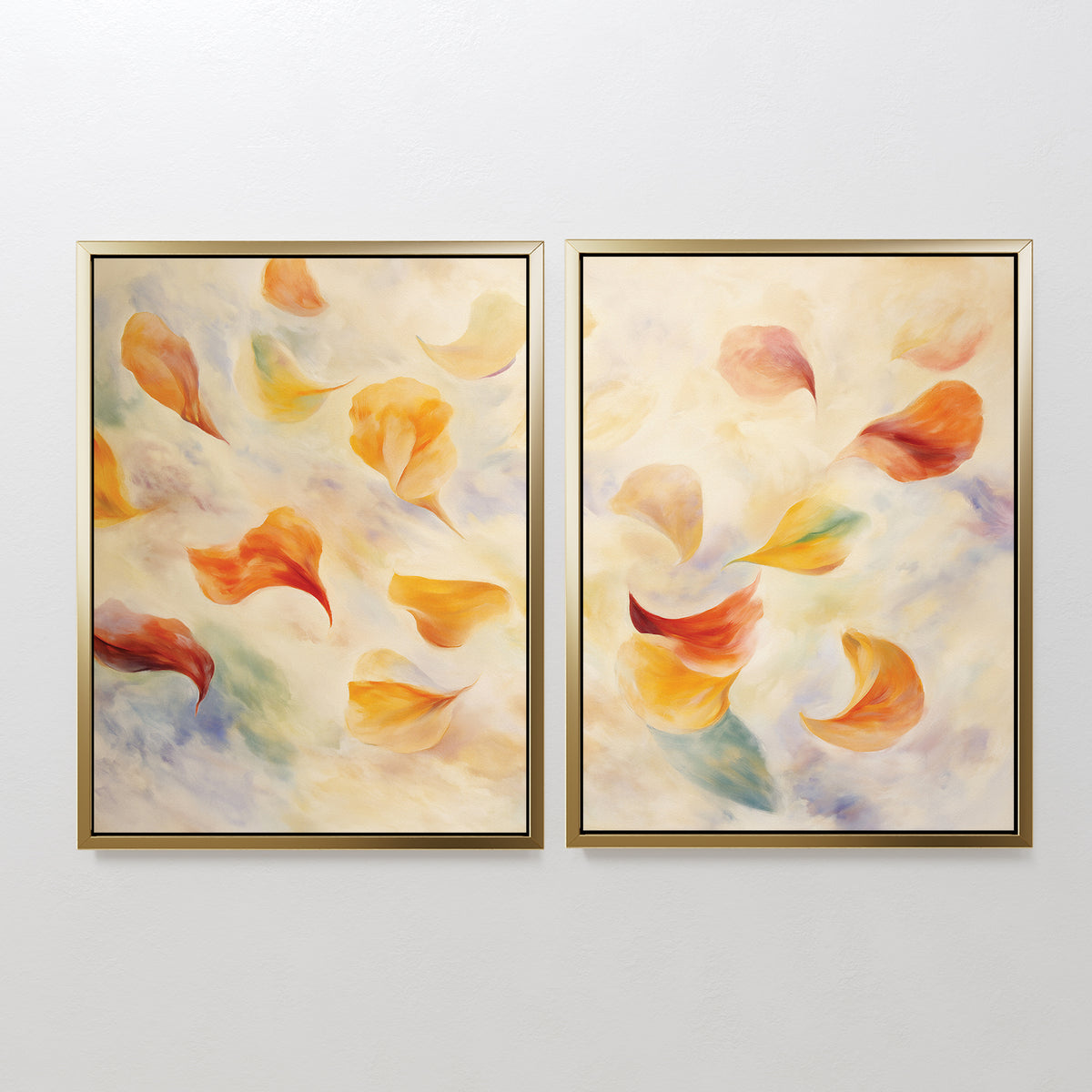 The Floating Petals - Set of 2 features framed canvas prints with swirling, colorful petals in yellow, orange, and red on a soft background, adding organic elegance to any white wall.