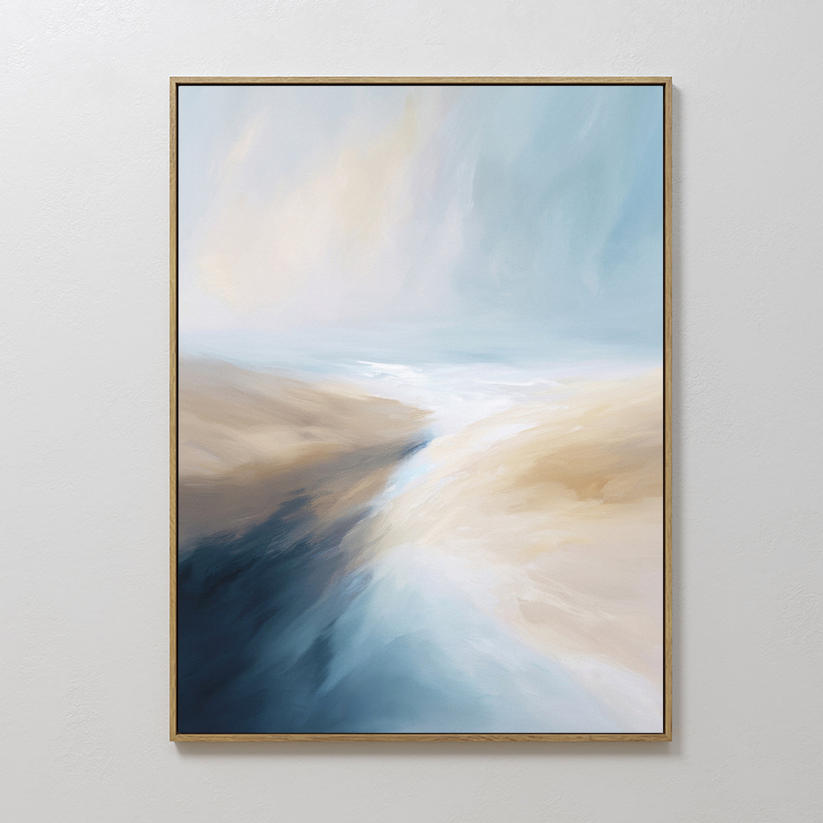 Fluid Motion Canvas Art - Vertical features a thin gold frame and abstract, flowing shapes in blue, white, and beige, evoking sky meeting sand—perfect coastal wall art for modern living room decor.