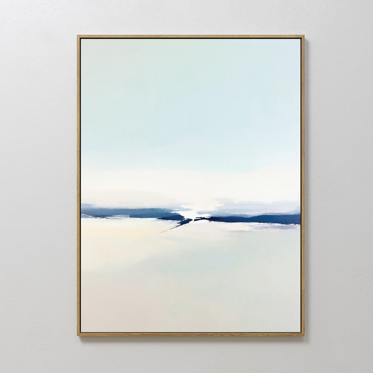 Frozen Channel Canvas Art - Vertical features serene pale blue, white, and beige gradients with a deep blue band. Framed in a slim, light frame and displayed on a white wall, it’s ideal for modern living room decor.