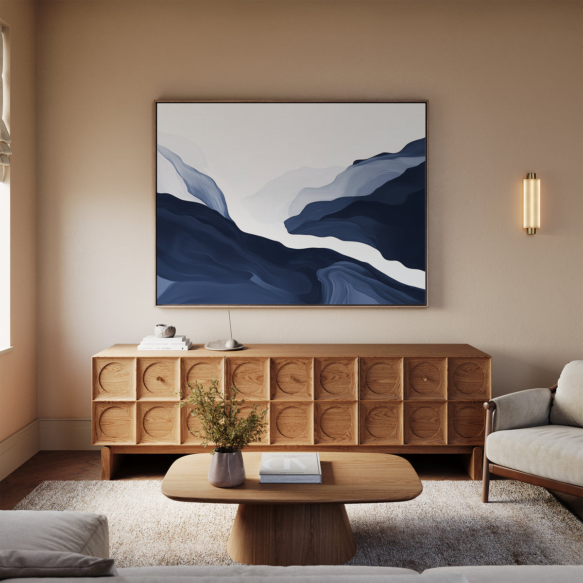 A modern living room with a light sofa, wooden coffee table, and a sideboard with circular details. Glacier Flow Canvas Art - Horizontal hangs above the sideboard, while a small plant brings freshness to the decor.