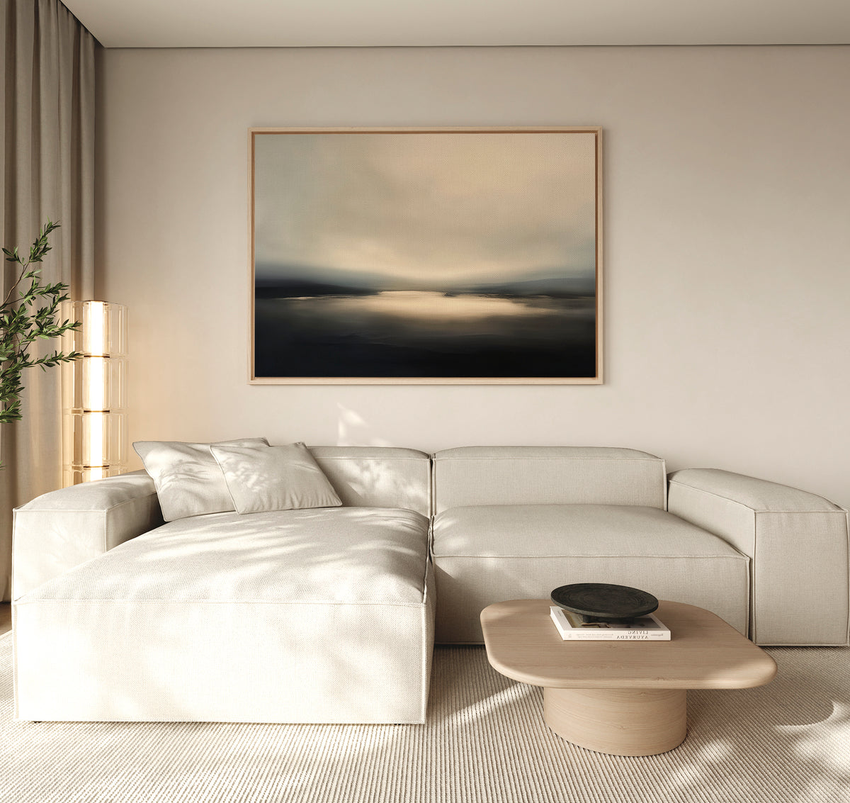 A modern living room with a light beige sectional sofa, wooden coffee table with a black bowl, neutral walls, and the Golden Fog Horizon Canvas Art - Horizontal above. A tall plant sits in the corner; sheer curtains let in natural light.