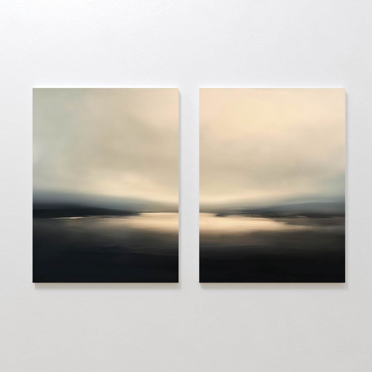 The "Golden Fog Horizon - Set of 2" features abstract coastal prints in soft beige, gray, and black tones, depicting serene water scenes under cloudy skies. Displayed side by side, they evoke the tranquil beauty of Nordic Park landscapes.