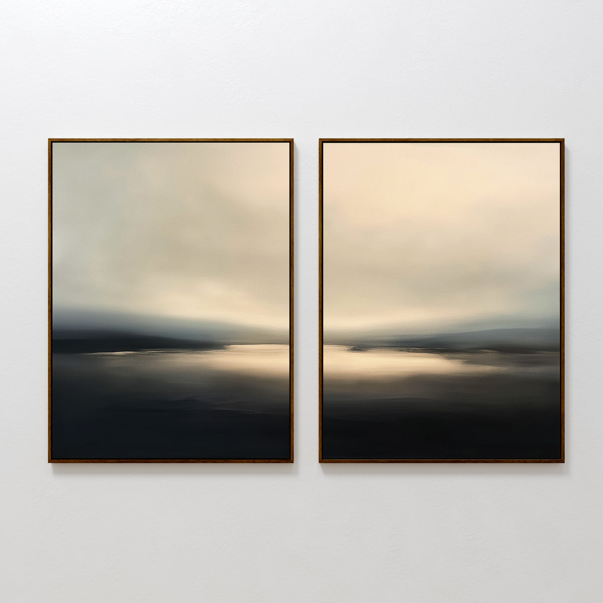 The Golden Fog Horizon - Set of 2 features framed abstract landscape art in soft, blurred blue, gray, and beige tones, evoking a calm water scene beneath a hazy sky. These pieces hang side by side on a white wall for a serene Nordic touch.