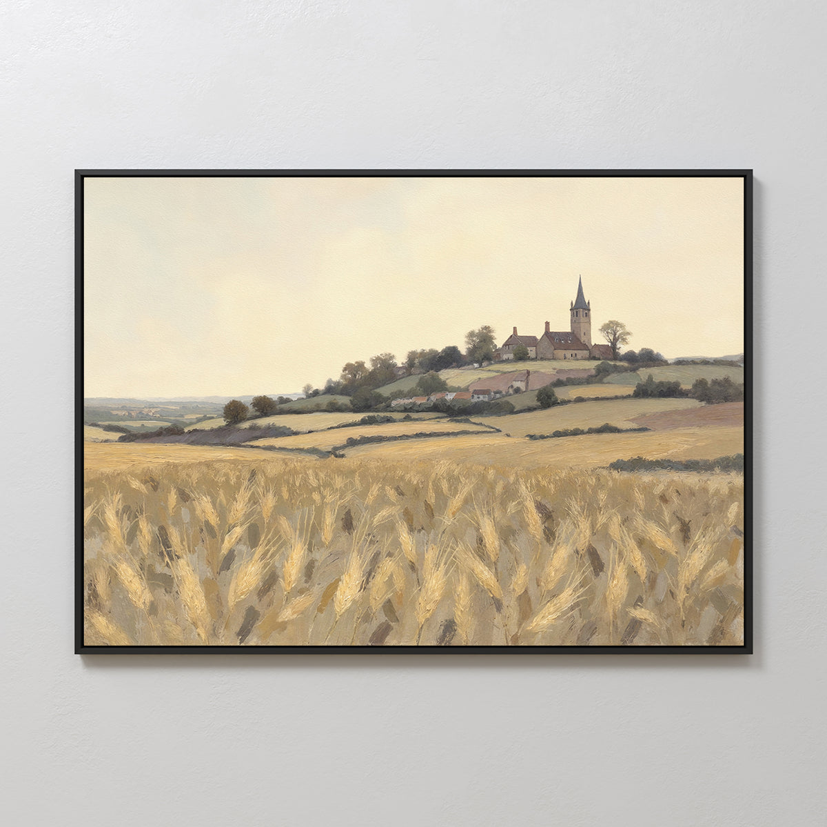 Harvest Chapel Canvas Art - Horizontal: A framed rural landscape print with golden wheat fields and a hilltop chapel beneath a hazy sky—ideal as pastoral home decor or rustic wall art.