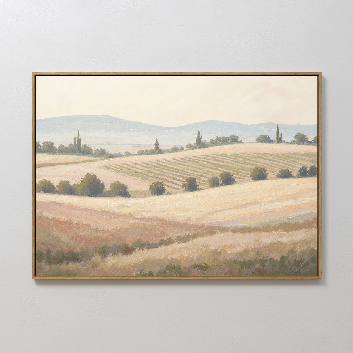 Harvest Fields Canvas Art - Horizontal features a serene pastoral landscape with rolling hills and crops in soft, muted colors, adding timeless charm as wall art to any plain, light-colored wall.