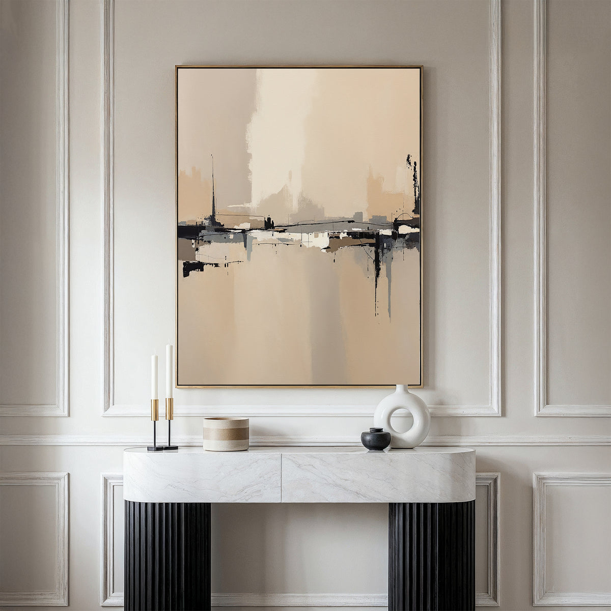 A minimalist console table with modern decor stands against a creamy paneled wall, topped by the Industrial Cityscape Canvas Art - Vertical, whose abstract city design in neutral tones adds sophistication to the elegant space.