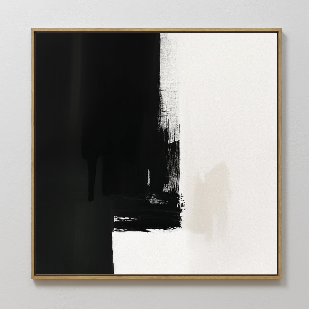 The Ink Divide Canvas Art - Square features bold black and white sections with textured brushstrokes. Predominantly black on the left and white on the right, this contemporary wall art creates a striking visual contrast.