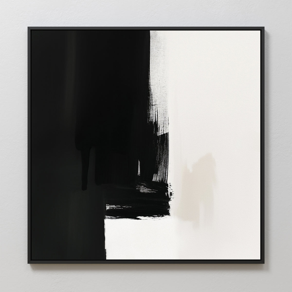 The Ink Divide Canvas Art - Square features bold black brushstrokes on the left fading into a white background, with subtle textures and sharp contrast. This contemporary minimalist piece is elegantly framed in black.