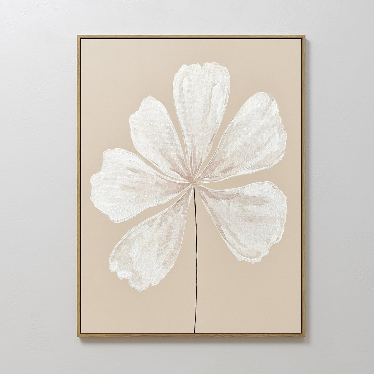 Ivory Bloom Canvas Art - Vertical: A minimalist print of a white six-petaled flower with a thin stem on a beige background, framed in gold—ideal botanical wall art for neutral home decor.