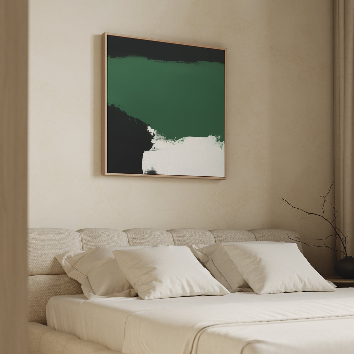 A minimalist bedroom featuring a beige bed with white pillows and sheets, highlighted by the Jade Depths Canvas Art - Square in green, black, and white above the headboard. A bare branch on a table adds to the modern decor vibe.