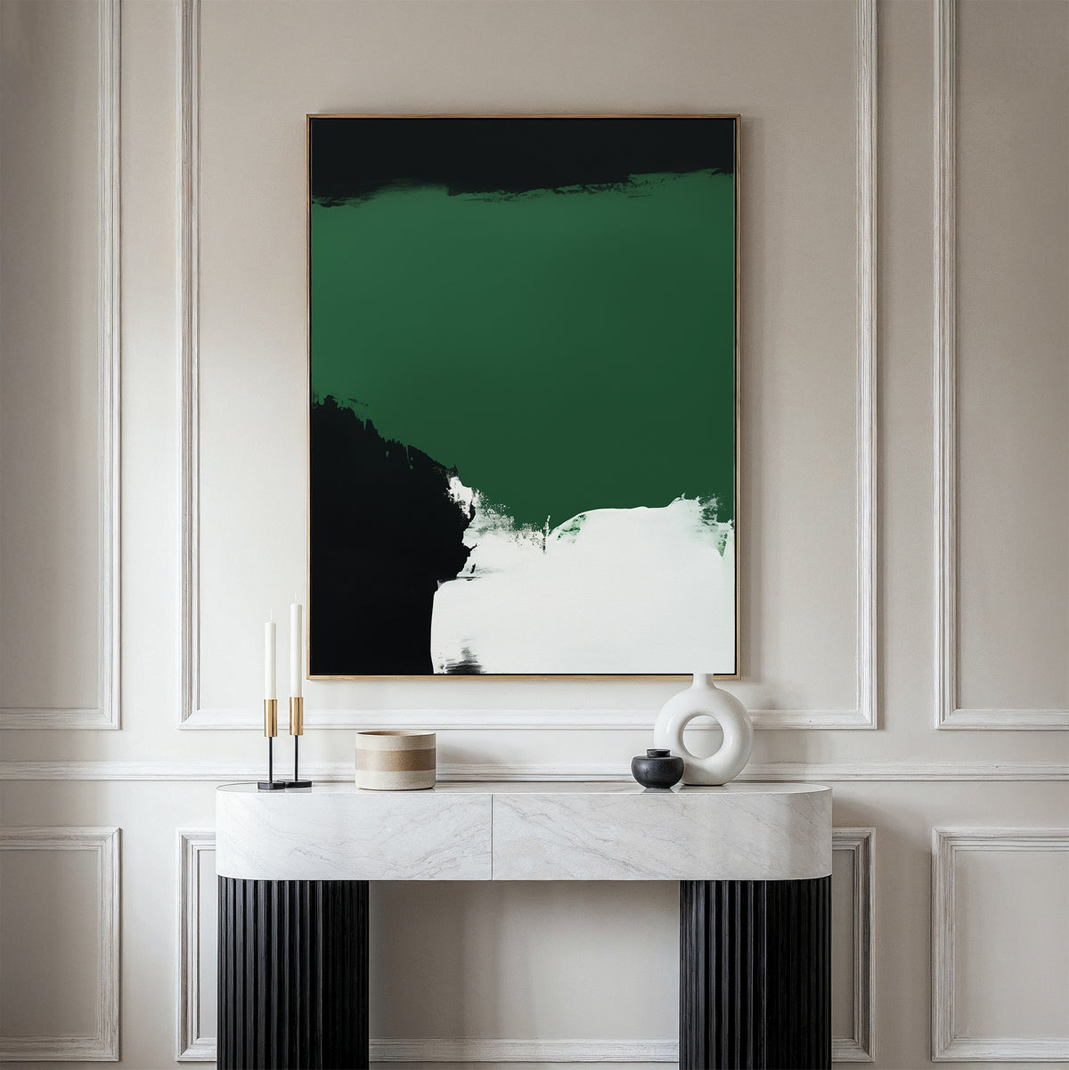 A modern console table with a white marble top holds minimalist decor beneath the Jade Depths Canvas Art - Vertical, an abstract emerald green print, set against a light-paneled wall—perfect for contemporary living room decor.