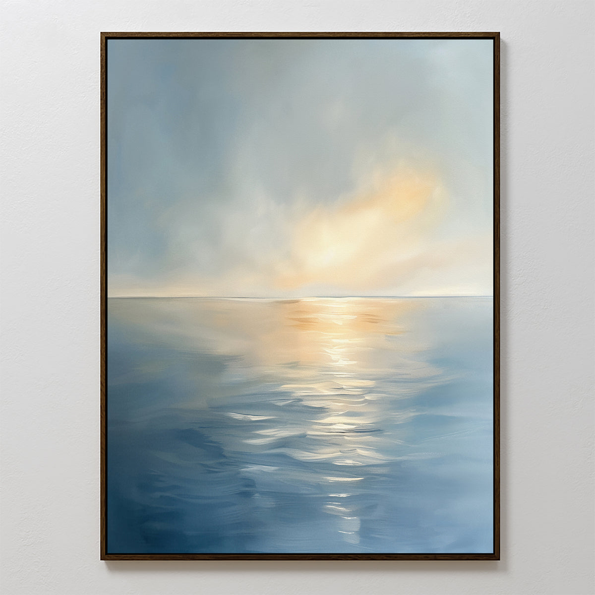 The Luminous Calm Canvas Art - Vertical features a tranquil sea with gentle ripples, reflecting soft sunlight through clouds in soothing blue, gray, and warm yellow hues—perfect for adding a serene coastal touch to any space.