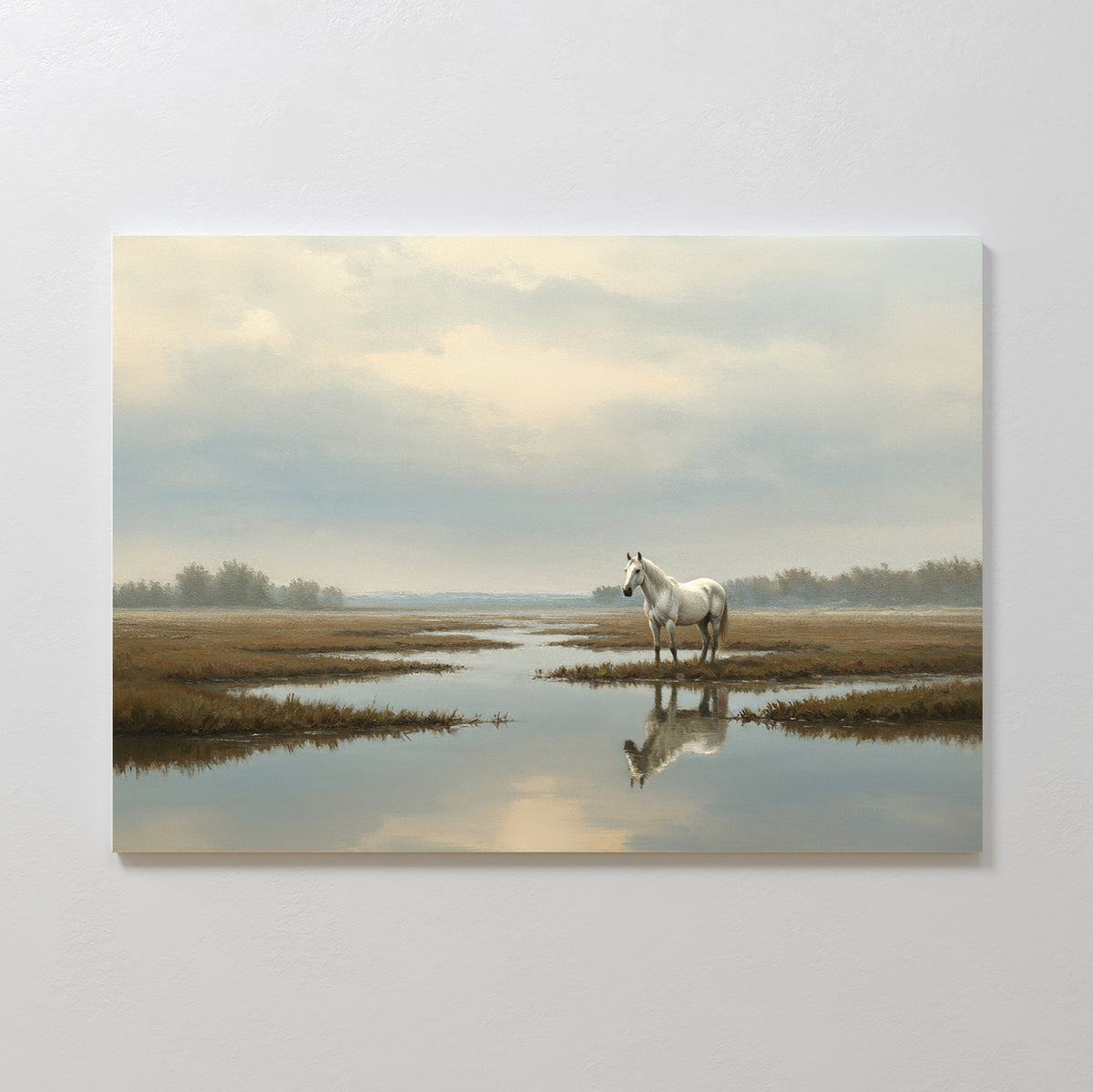The Marsh Reflection Canvas Art - Horizontal features a white horse in a marshy landscape, its reflection mirrored in calm water beneath a cloudy sky, with distant trees evoking the tranquil spirit of Nordic Park.