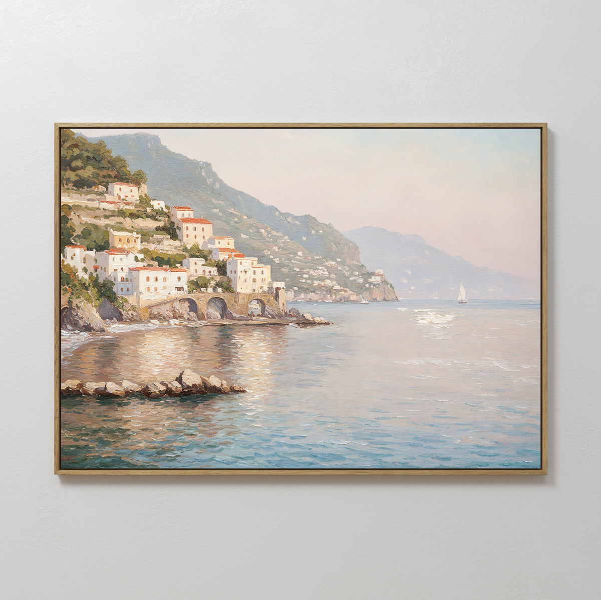 The Mediterranean Dreams Canvas Art - Horizontal features a tranquil coastal village on green cliffs above a calm blue sea with a distant sailboat, making it an ideal choice for serene home decor.