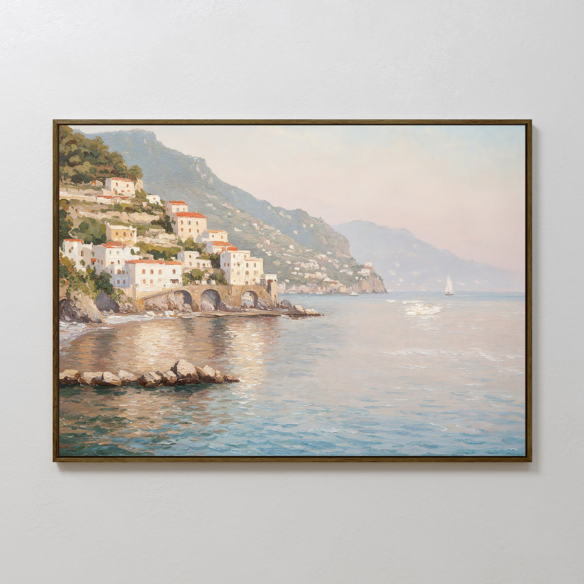 The Mediterranean Dreams Canvas Art - Horizontal features a framed coastal village with colorful hillside houses, rocky cliffs, a sailboat, and soft sunlight on calm water—ideal for serene home decor.