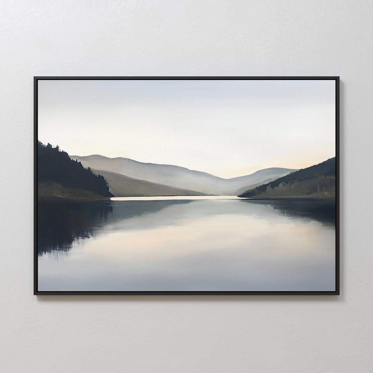 The Mirror Valley Canvas Art - Horizontal features a tranquil landscape with a serene lake reflecting distant hills and a misty sky, in calming natural tones and soft brushwork, displayed on a light-colored wall.