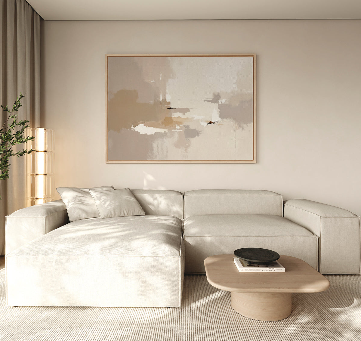 A modern living room with a light beige sectional, a low wooden coffee table with a black bowl, the Neutral Territory Canvas Art - Horizontal on the wall for contemporary elegance, a tall plant in the corner, and soft natural light filling the space.