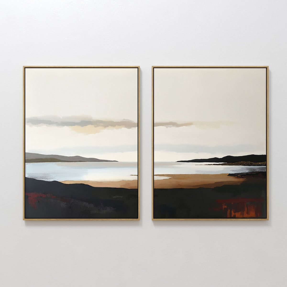 The "Nordic Waters - Set Of 2" features framed prints of serene water, distant mountains, and a cloudy sky in earthy tones—ideal for calming room decor when hung side by side on a white wall.