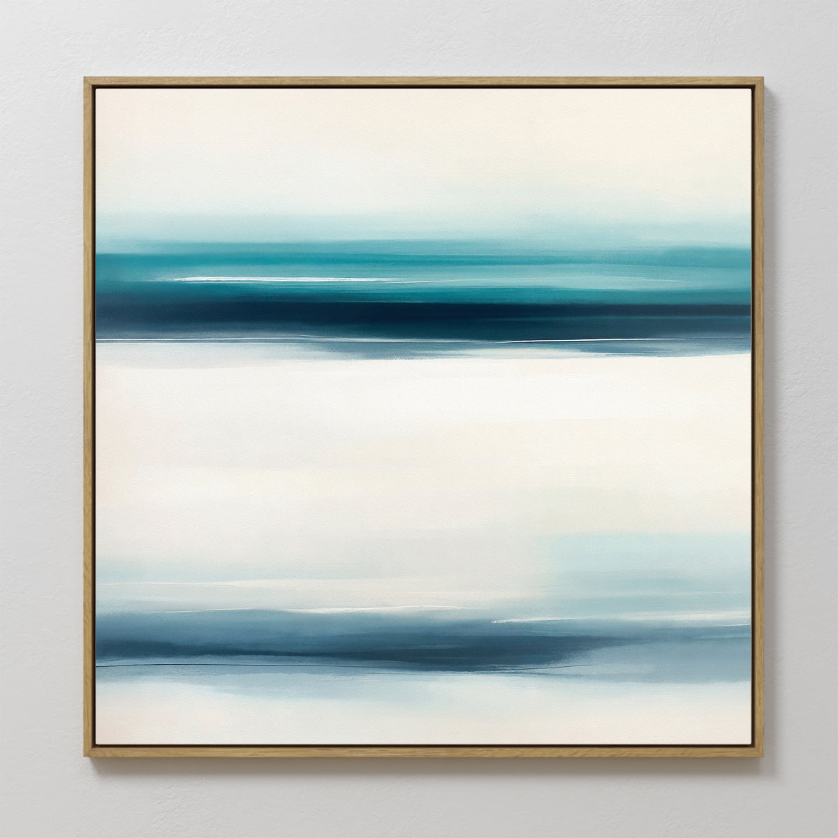 The Ocean Motion Canvas Art - Square showcases a minimalist abstract design with soft blue, teal, and white bands, framed in thin gold for a serene and sophisticated touch on any light-colored wall.