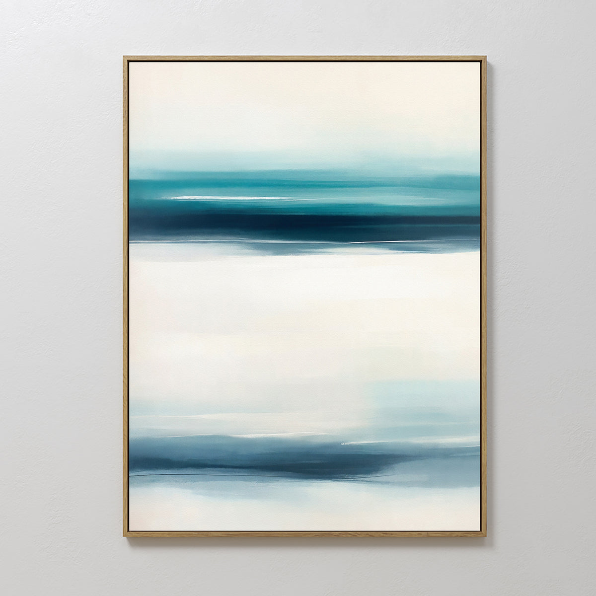 Ocean Motion Canvas Art - Vertical features an abstract print with teal, blue, and white horizontal bands for a serene, blurred landscape effect. Framed in slim gold, it brings sophisticated style to any coastal decor.