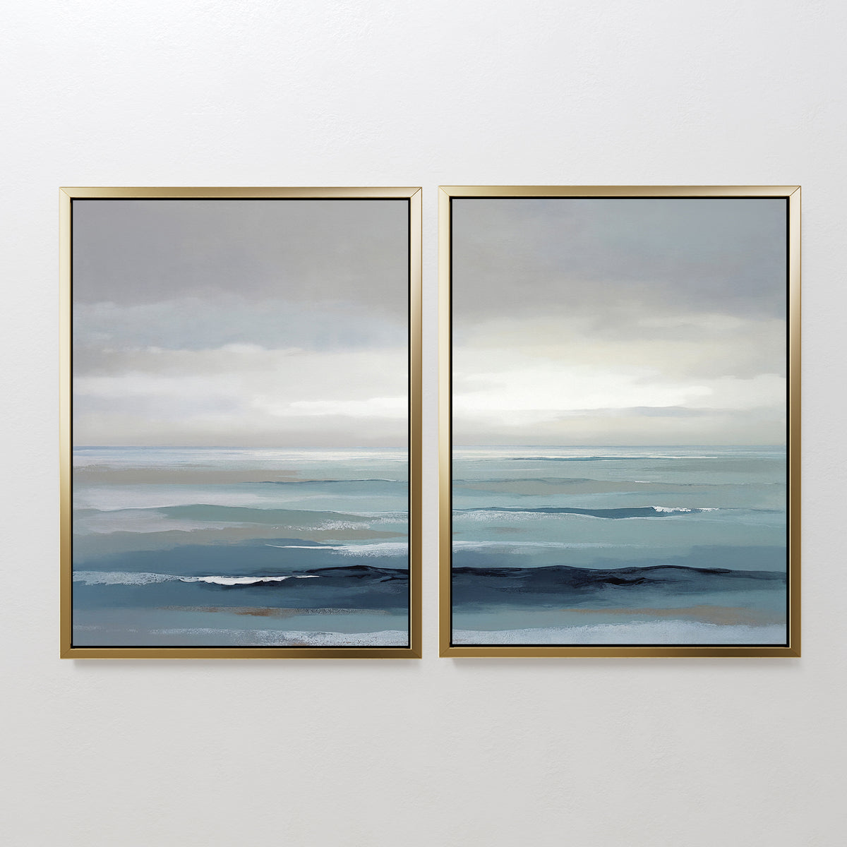 Ocean Swells - Set Of 2 features two framed paintings showcasing gentle waves and a cloudy sky in soft blue and gray tones, bringing a peaceful, minimalist Nordic Park feel—ideal as serene wall art for any space.