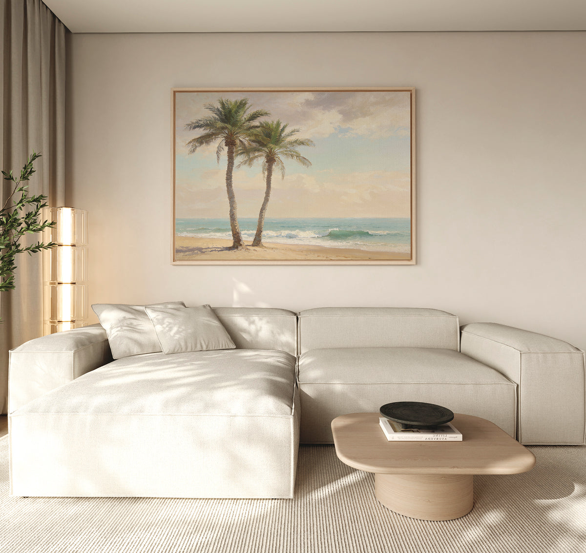 A modern living room with a light beige sectional, wooden coffee table, and the Paradise Found Canvas Art - Horizontal depicting palm trees and a beach. Neutral tones and natural light complete the serene, coastal-inspired space.