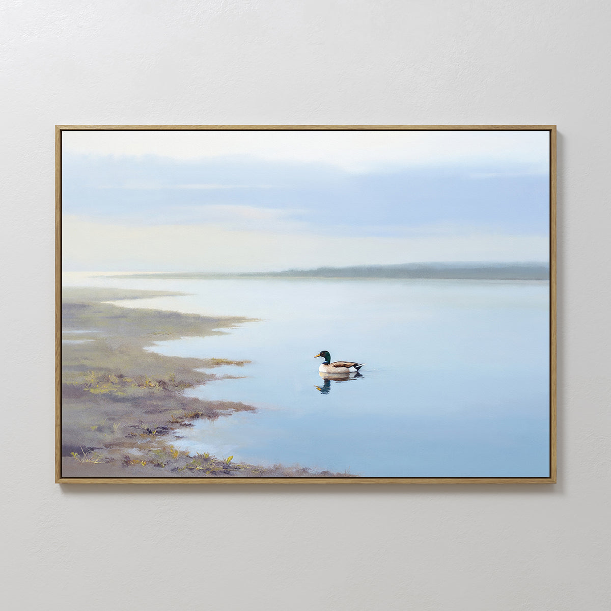 The "Peaceful Duck Haven Canvas Art - Horizontal" is a framed painting of a calm lakeside, with a duck gliding near the shore, its reflection visible in the still blue water beneath a cloudy sky.